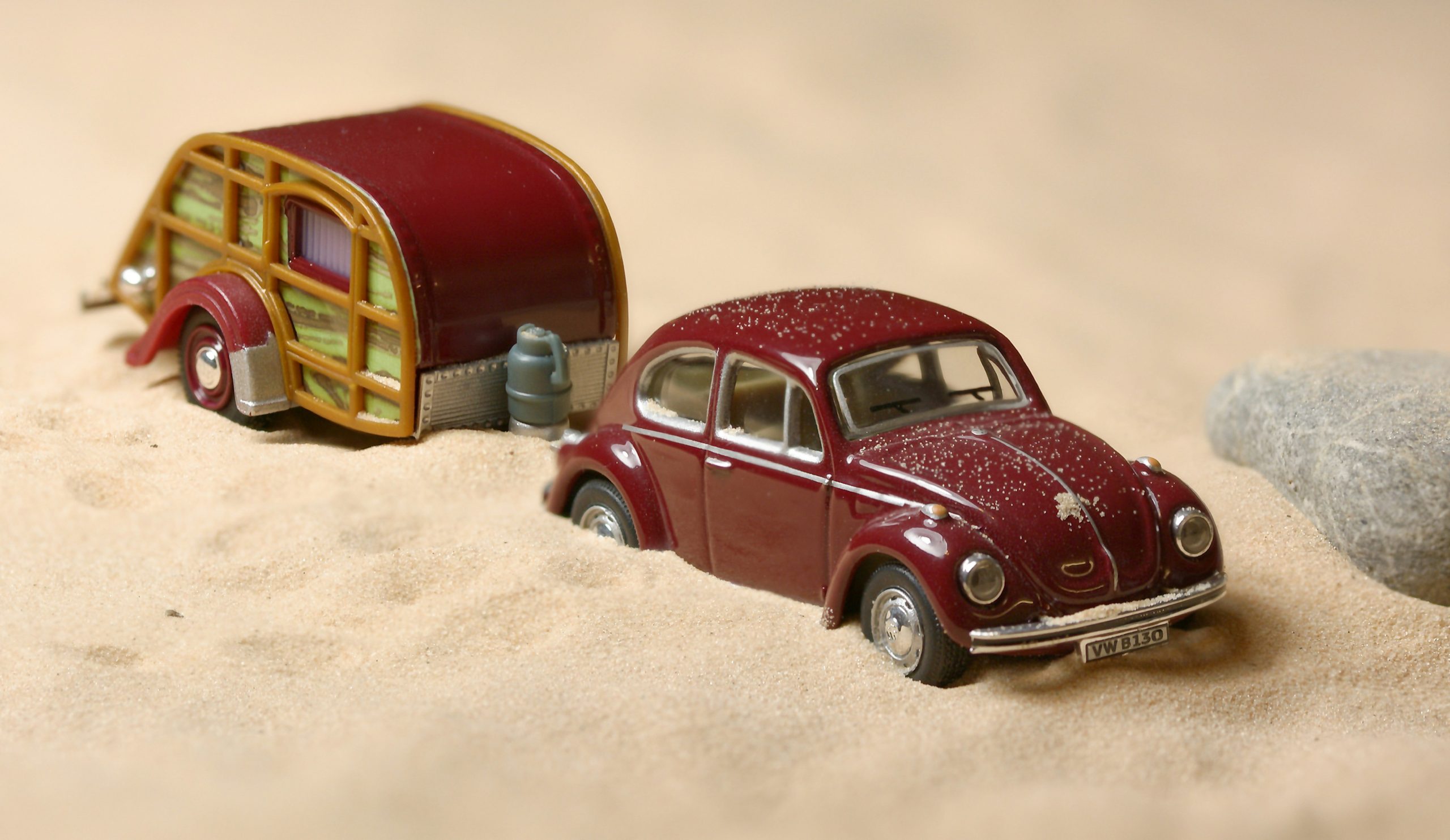 Toy car and trailer in sand Toy car and trailer in sand